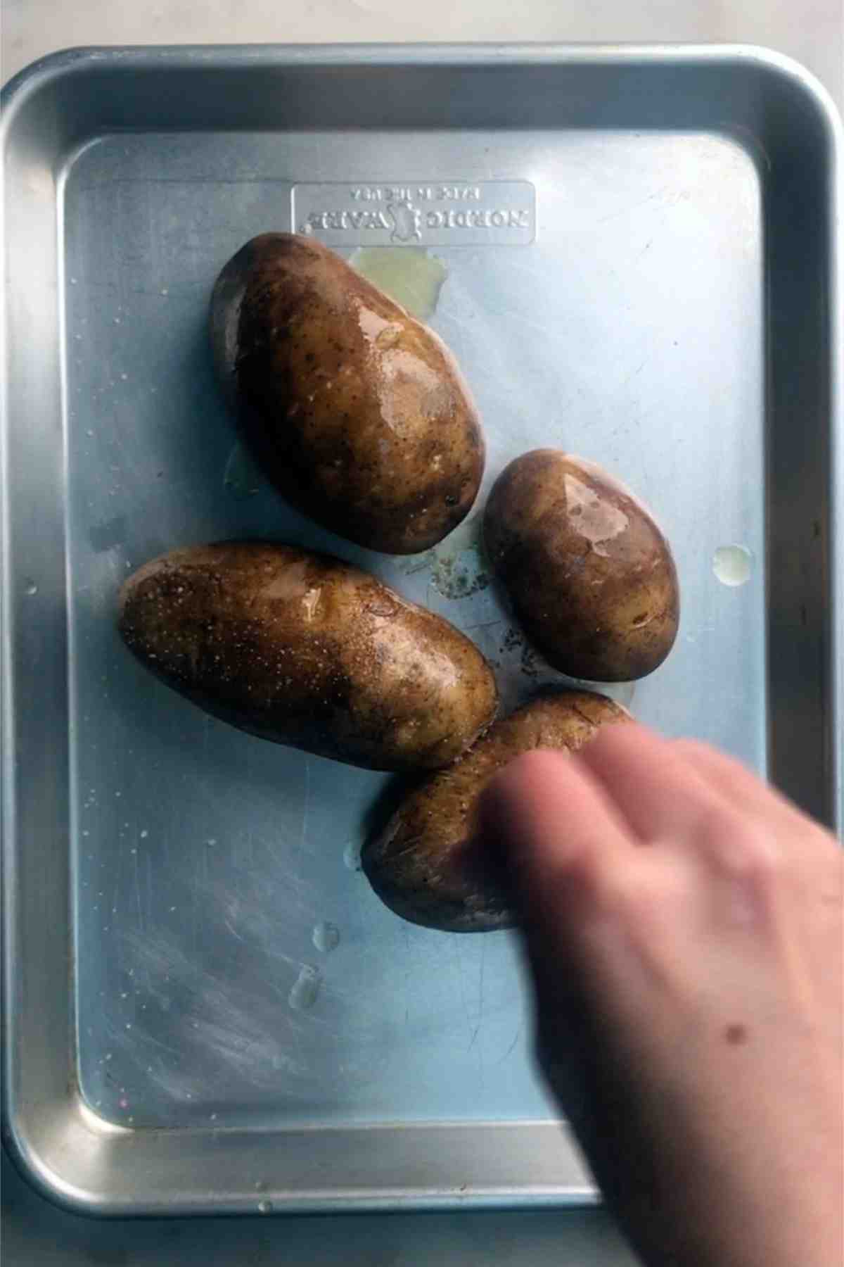 Potatoes on a baking sheet.