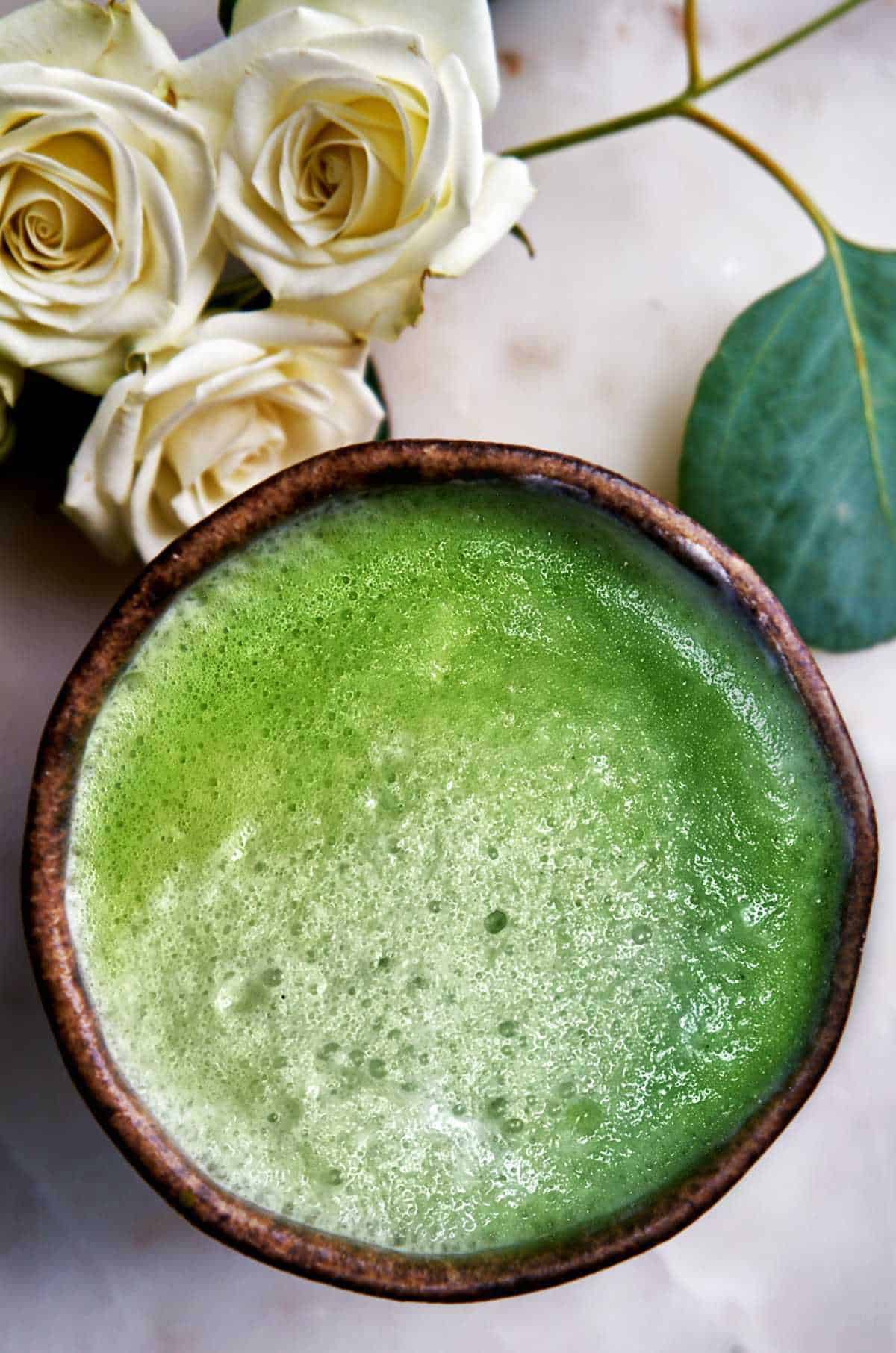 Bowl of matcha with roses.