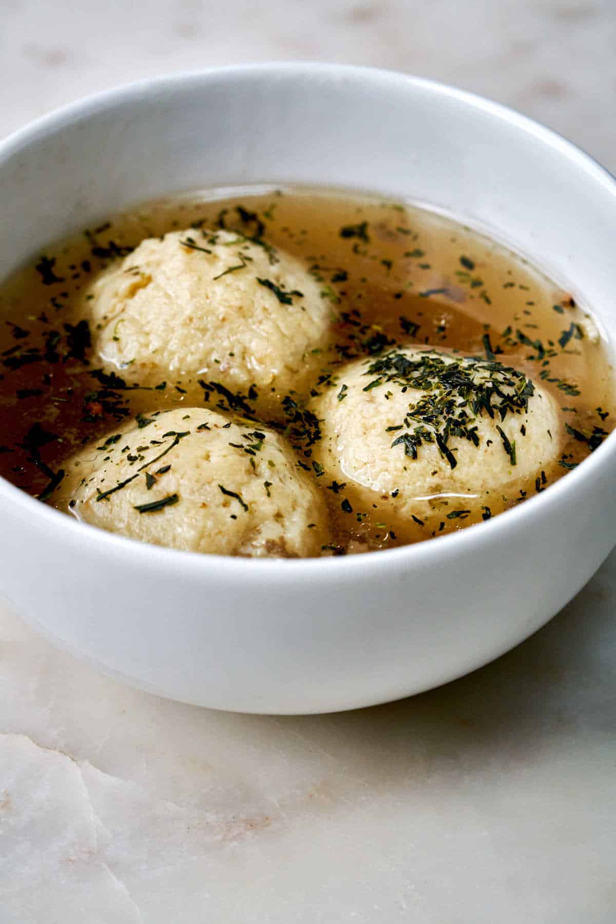 Matzo balls in soup with tea.