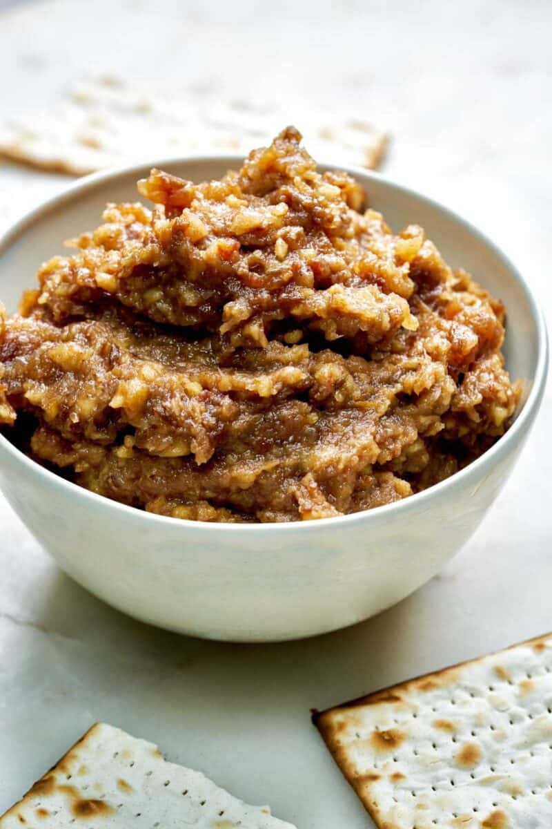 Bowl of brown dip with matzo.