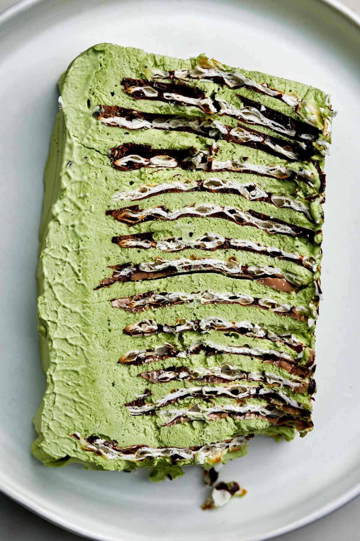 Slice of green ice box cake.