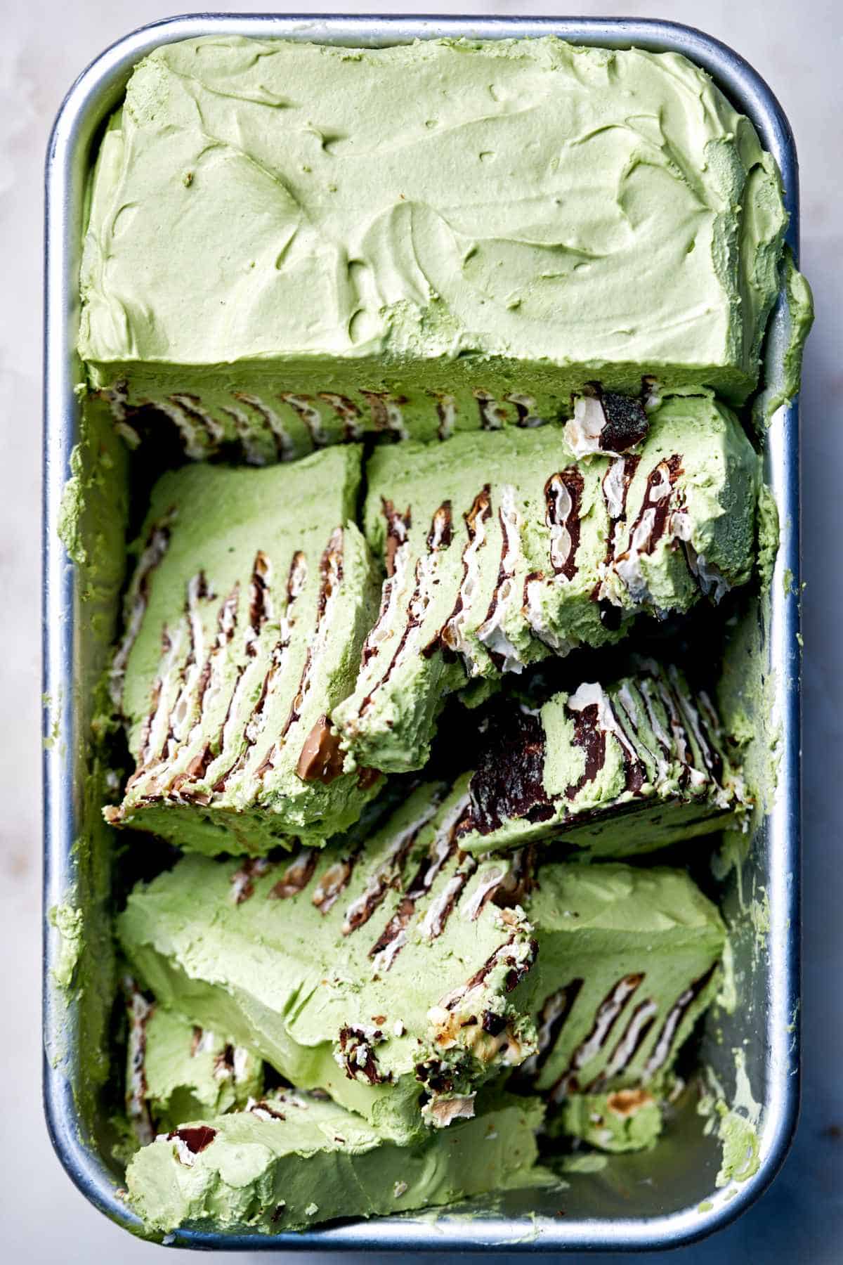 Green ice box cake in a tin.