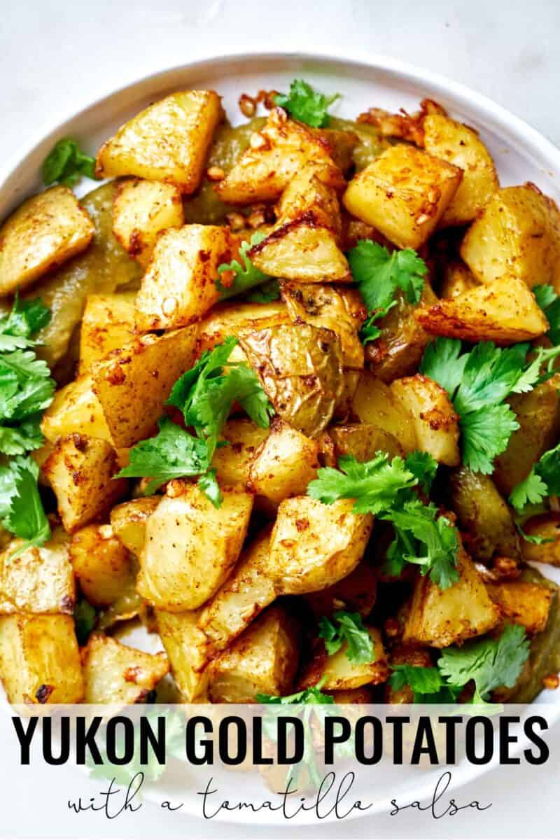 A plate of potatoes with cilantro and salsa.