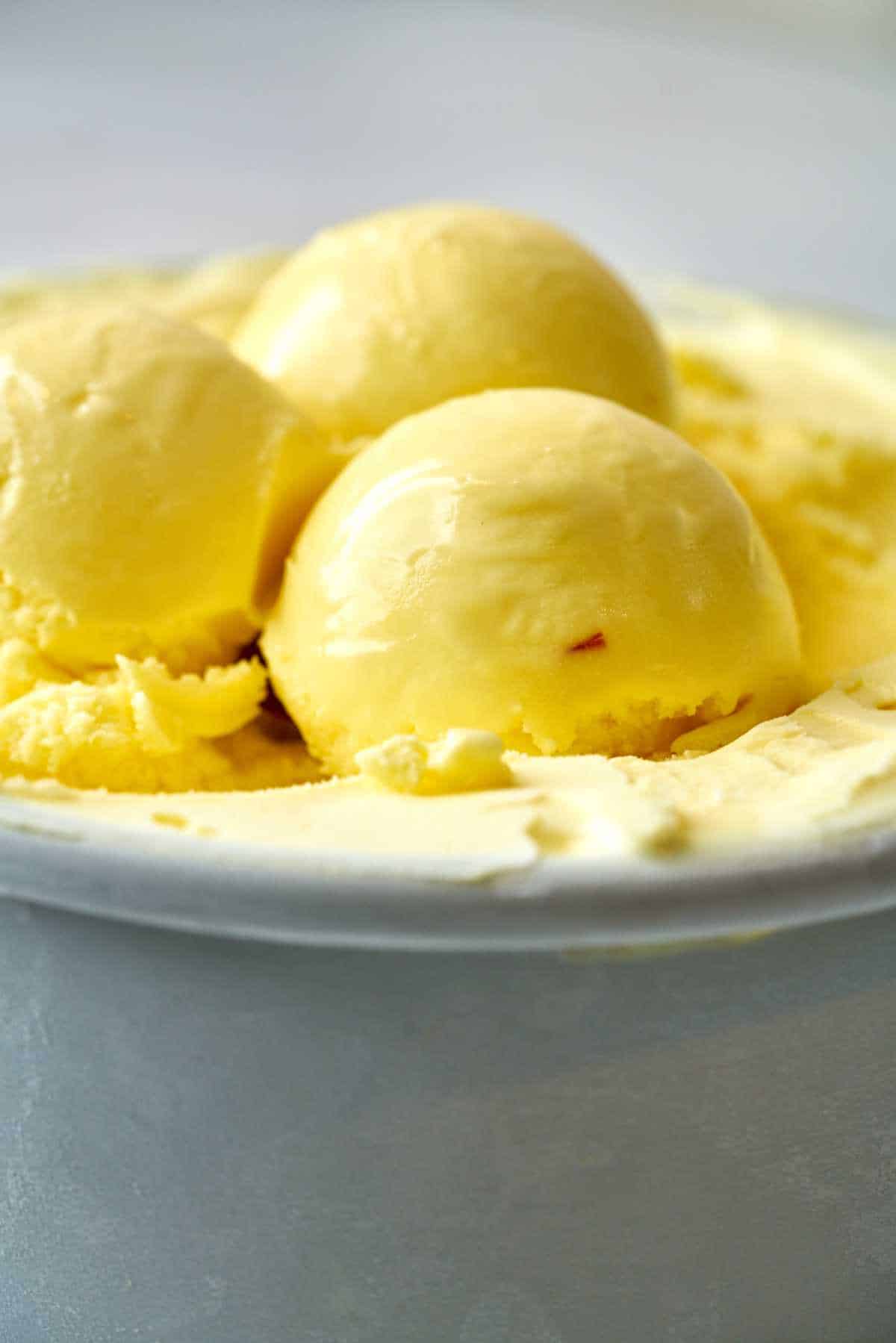 Scoops of yellow ice cream.
