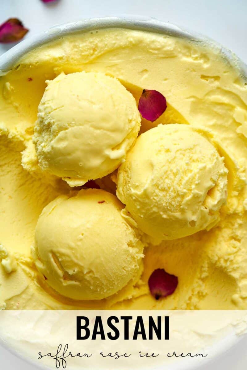 Scoops of yellow ice cream with rose petals.