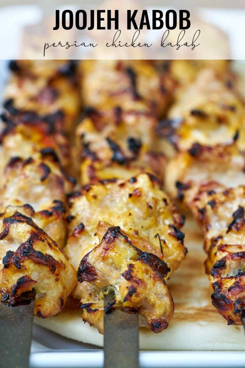 Chicken kabobs on metal skewers.