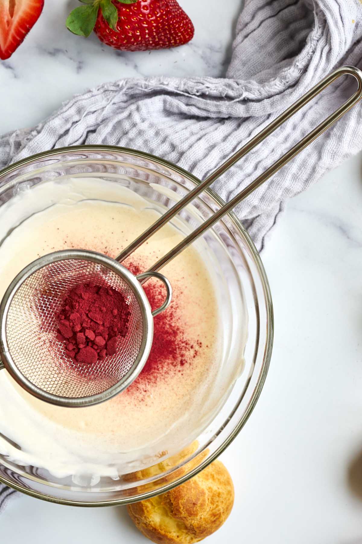 Pink powder in a sifter.