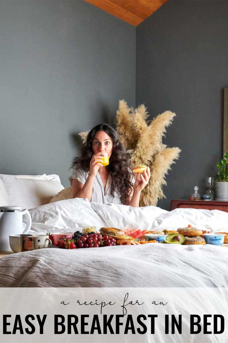 Woman in bed eating breakfast.