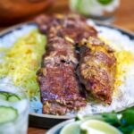 Kabob with rice and salad.