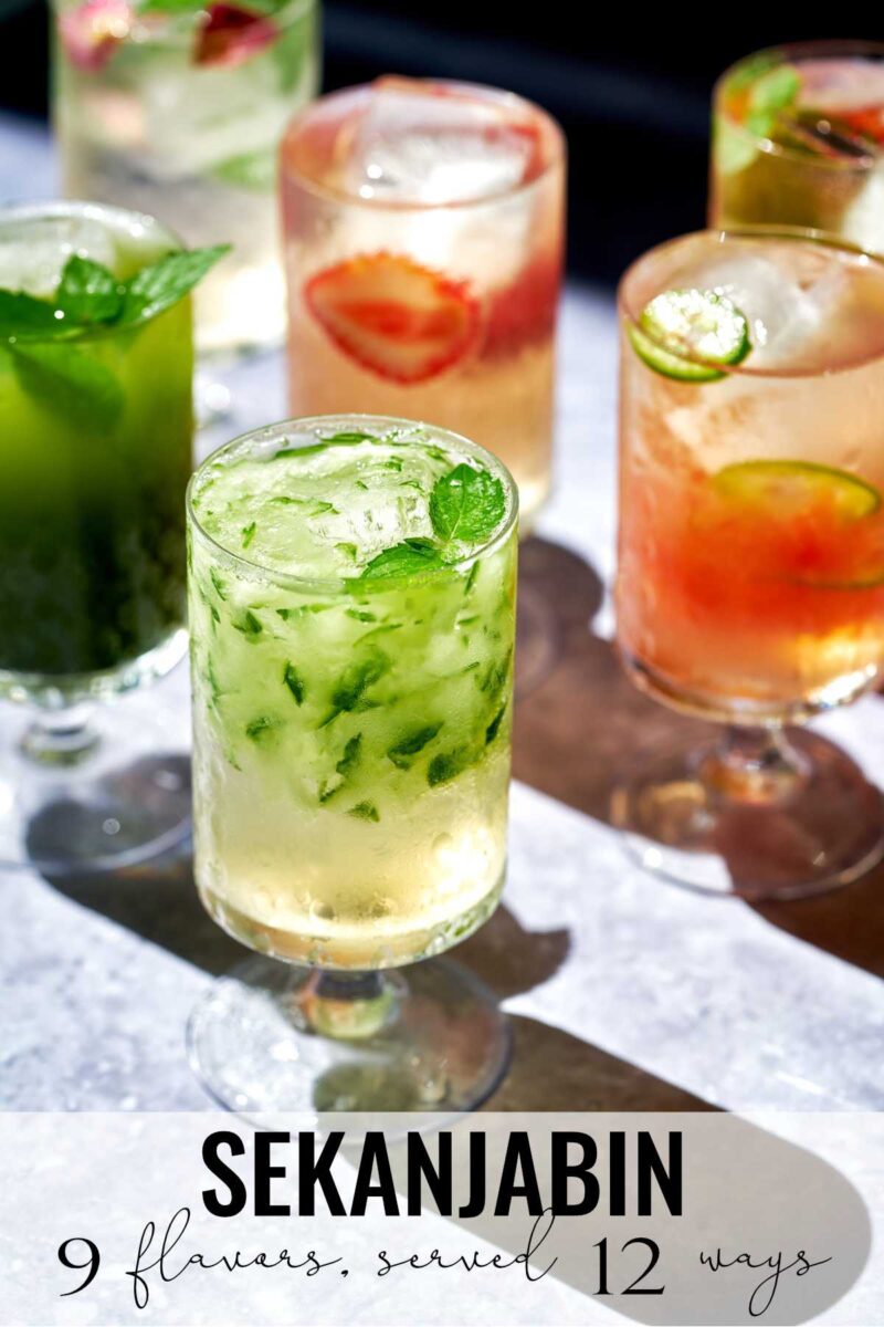 Glasses with different colored drinks.