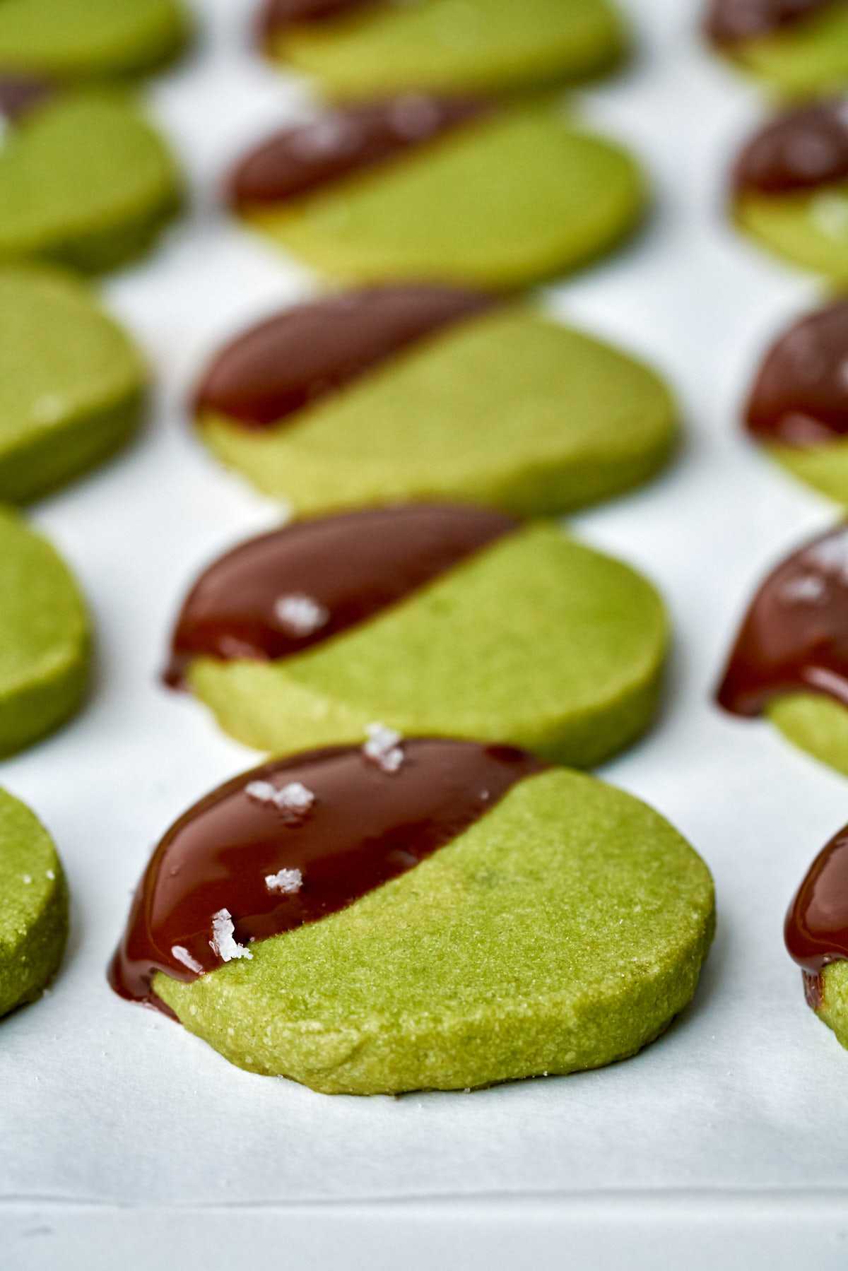 Green cookies dipped in chocolate with sea salt.