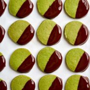 Green cookies dipped in chocolate.