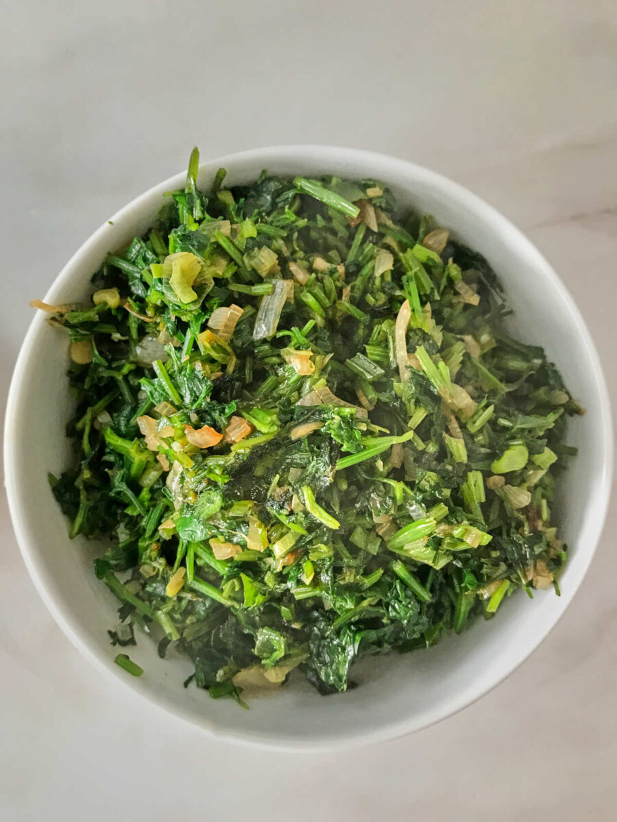 Cooked greens in a bowl.