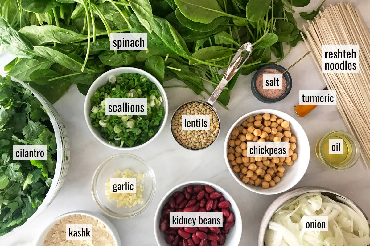 Spinach and other measured ingredients on a countertop.