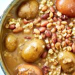 Bean soup in a pot with potatoes.