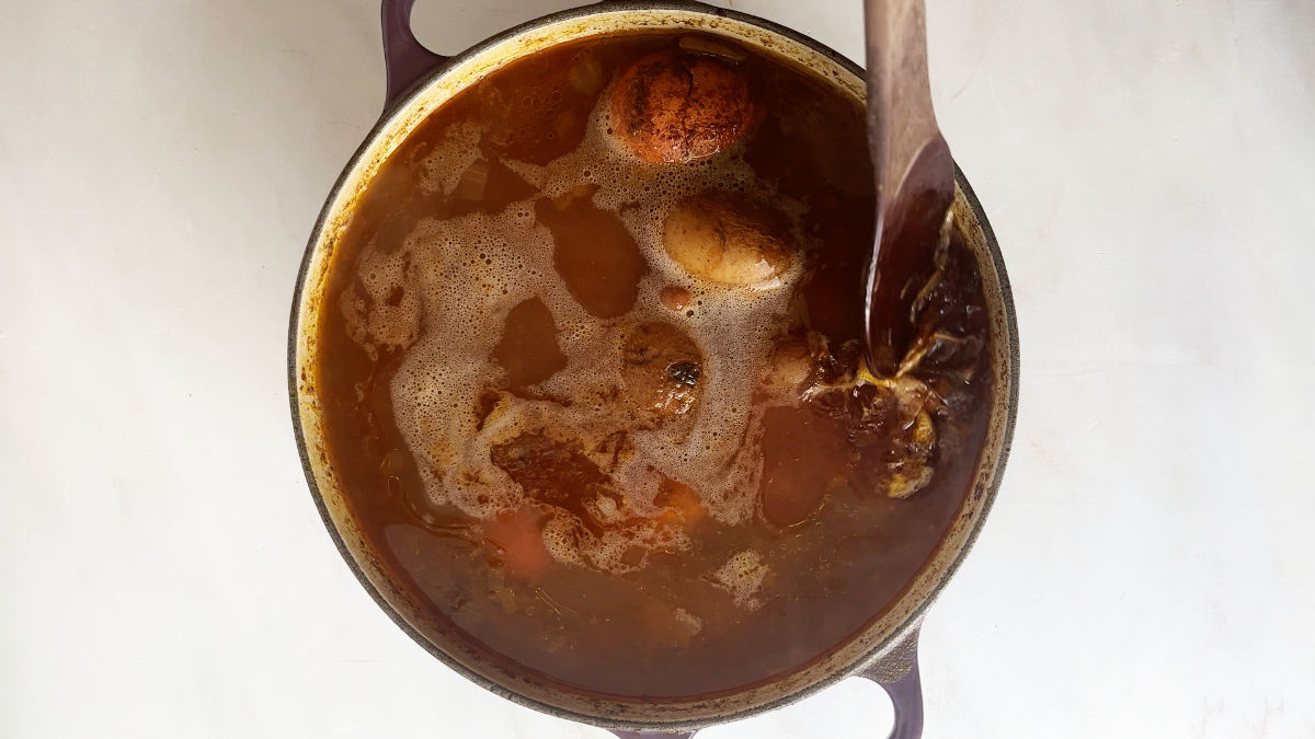 Bean and potato soup in a pot.