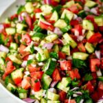 Plate of cucumber tomato salad.