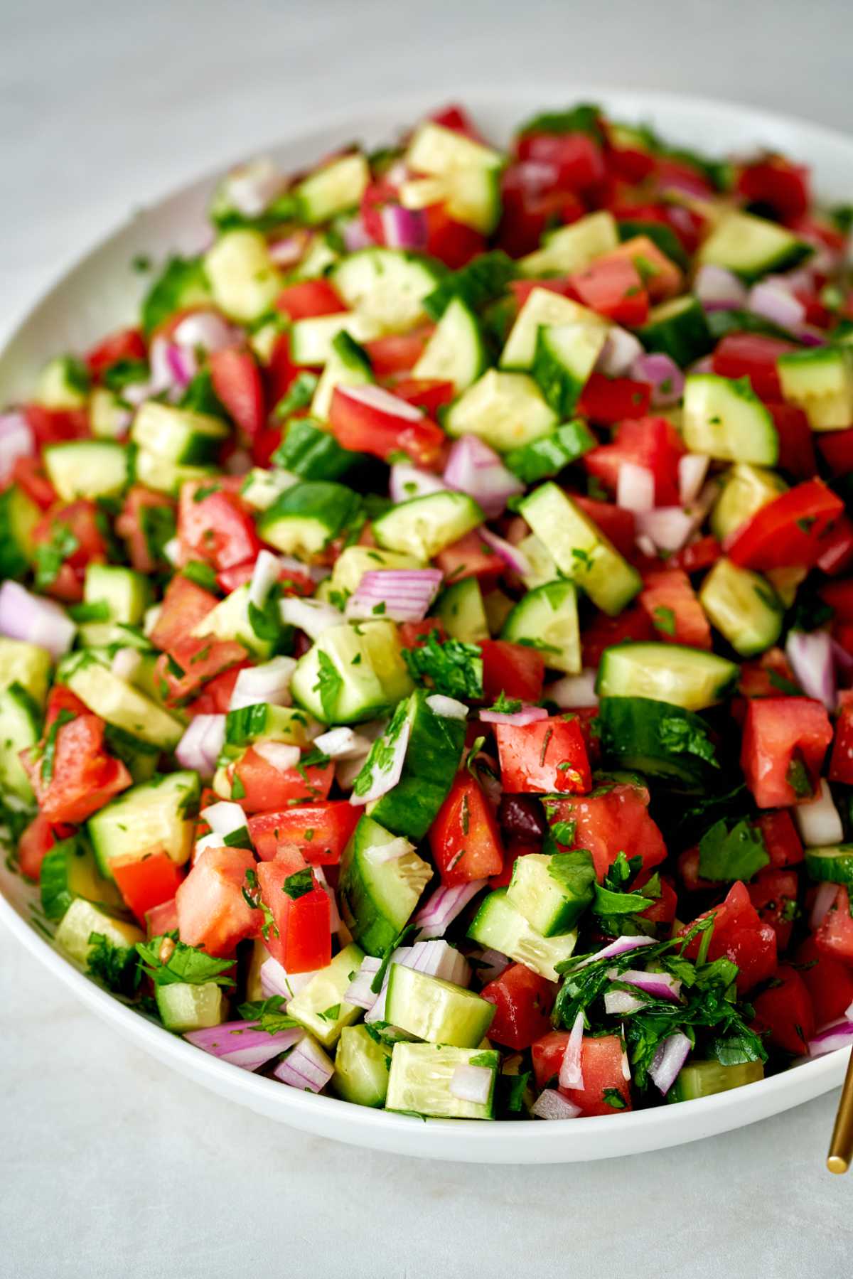 Plate of cucumber tomato salad.