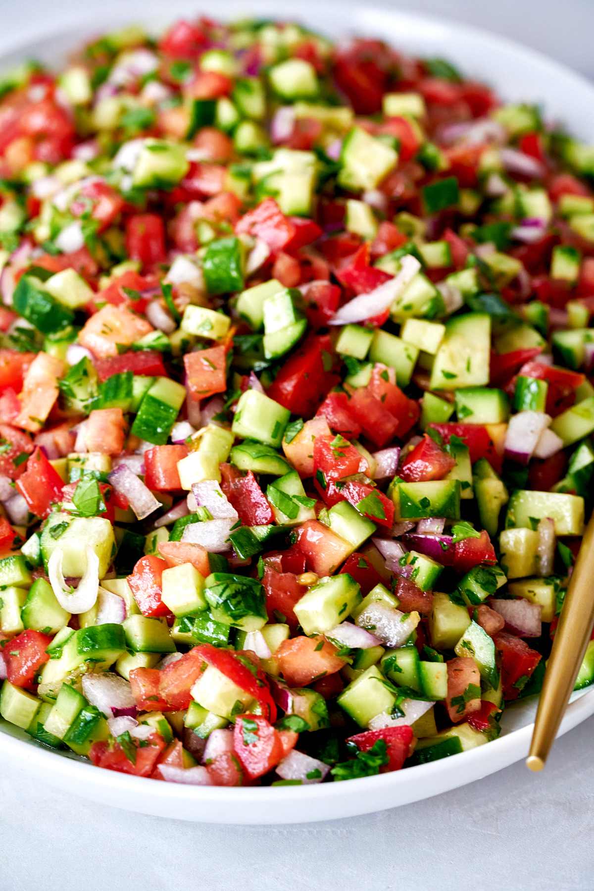 Plate of cucumber tomato salad.