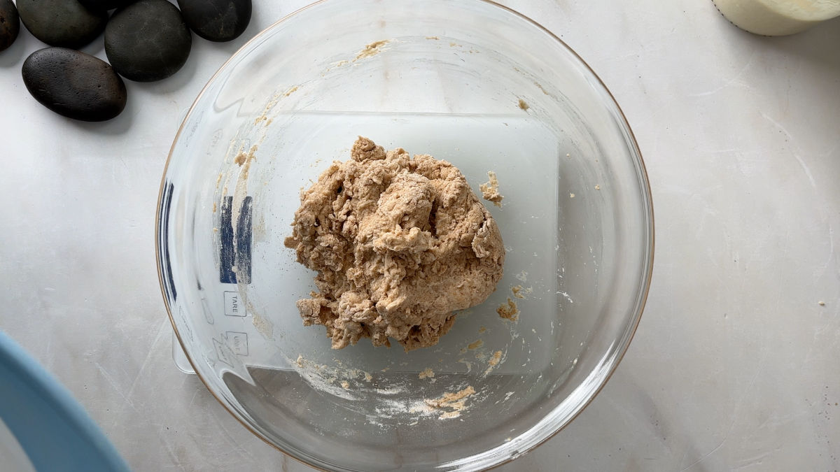 Dough in a glass bowl.