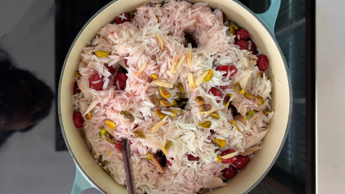 Rice pilaf in a pot with five holes.