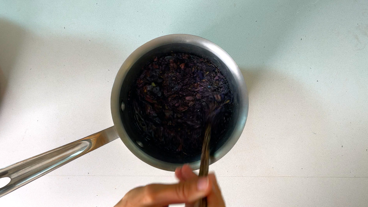 Purple flowers steeping in a pot.