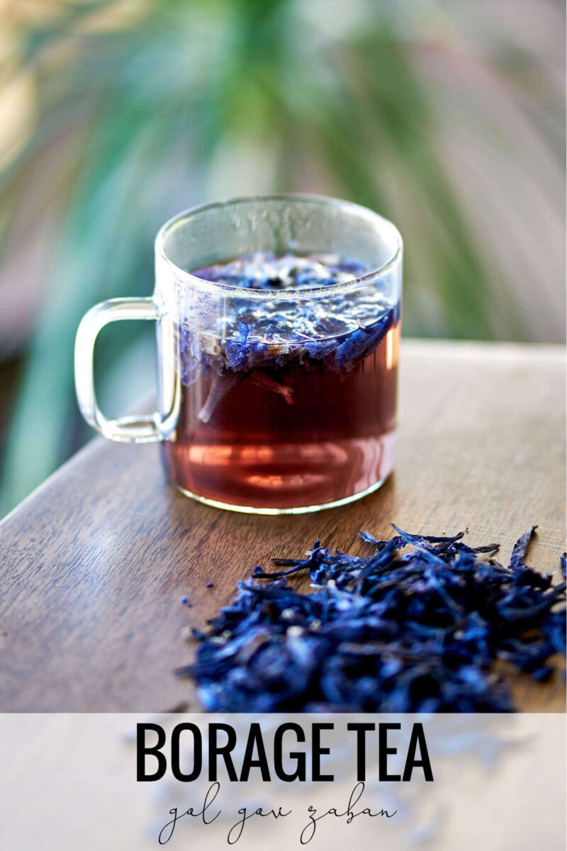 Glass of tea next to a pile of purple flowers with title text.