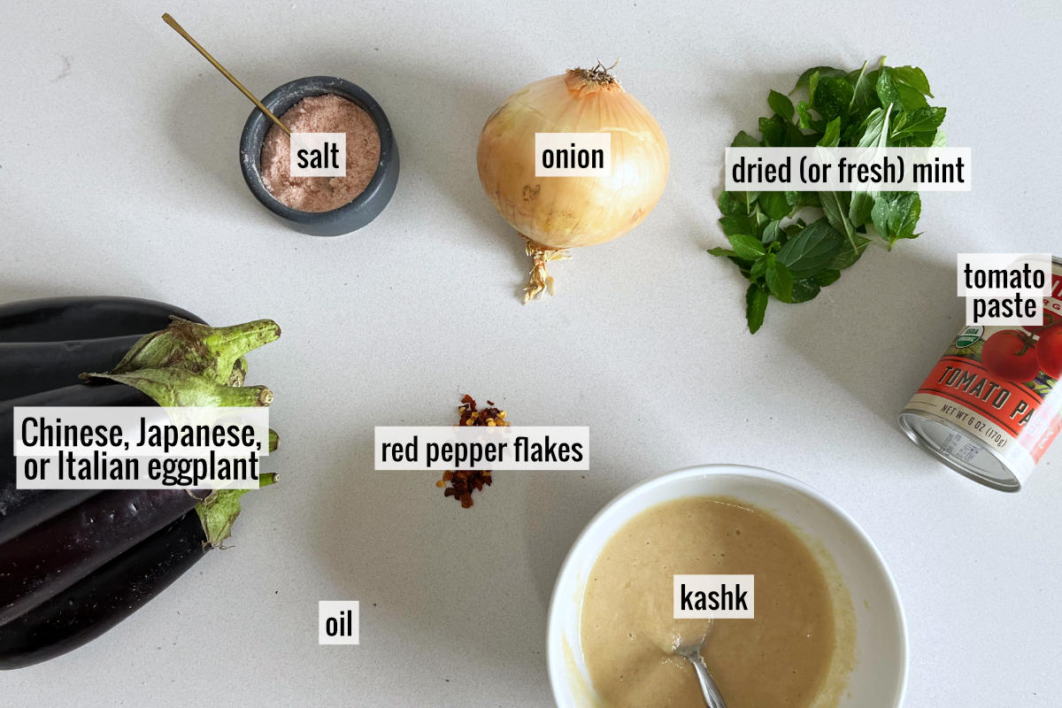 Eggplant and other labeled ingredients on a countertop.