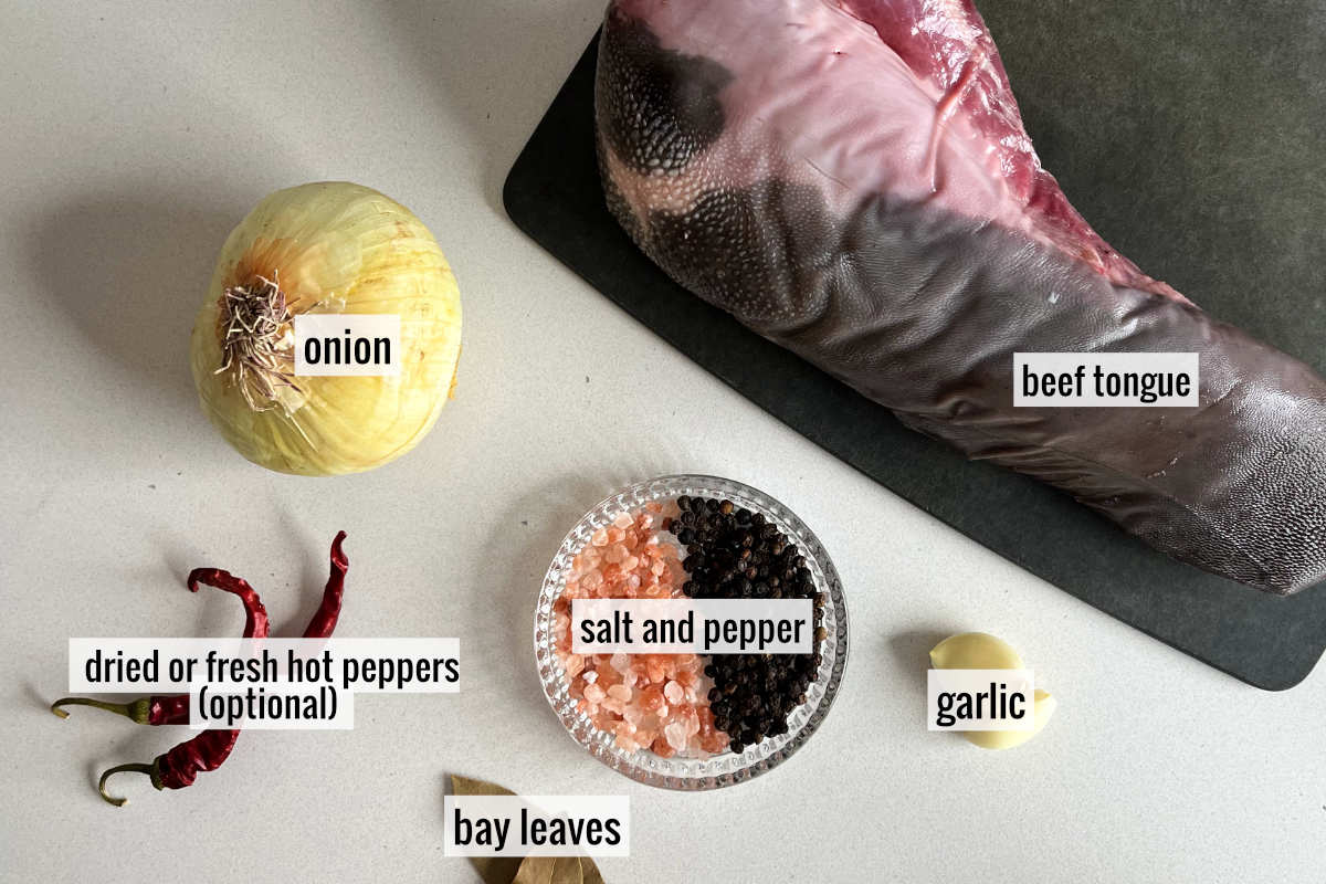 Cow tongue and other ingredients on a countertop.