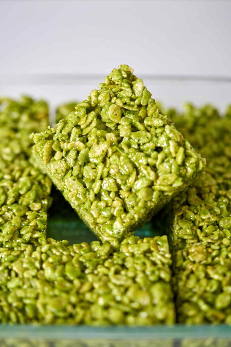 Green rice crispy treats in a baking dish.