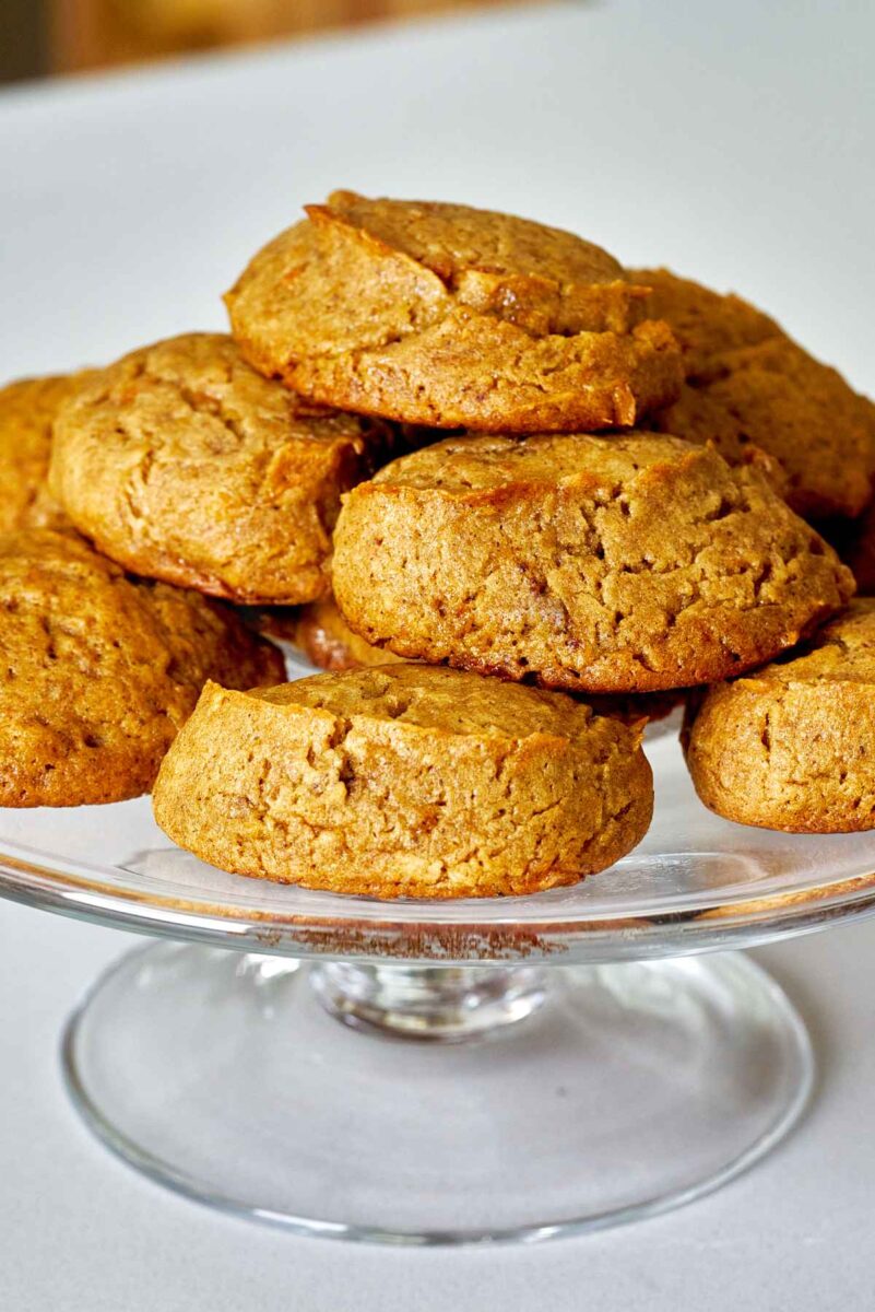 Cookies stacked on a glass pedestal.