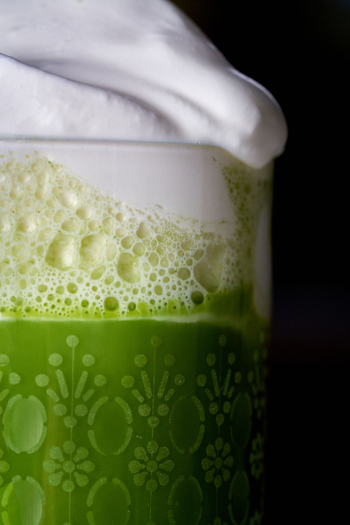 Close up of the frothy bubbles in a spiked Irish Matcha.