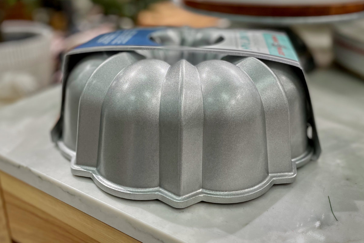 Silver bundt pan on a table.