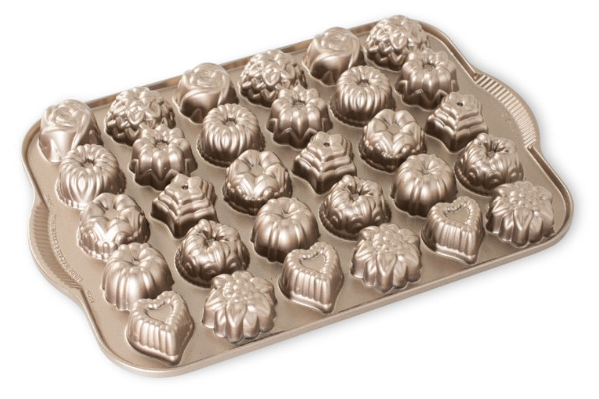 Teak cake pan with 30 mini tea cake molds.