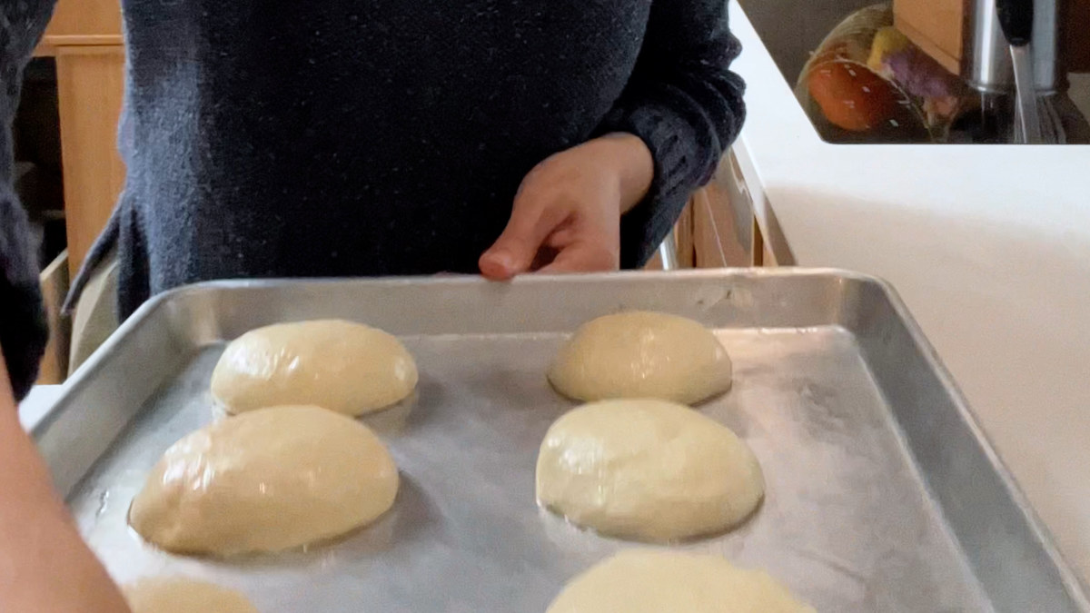 Dough balls on a baking sheet.