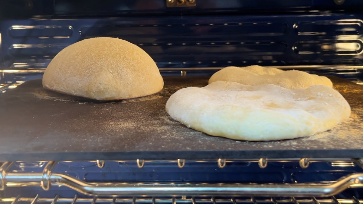 Pita puffing up in the oven on a baking steel.