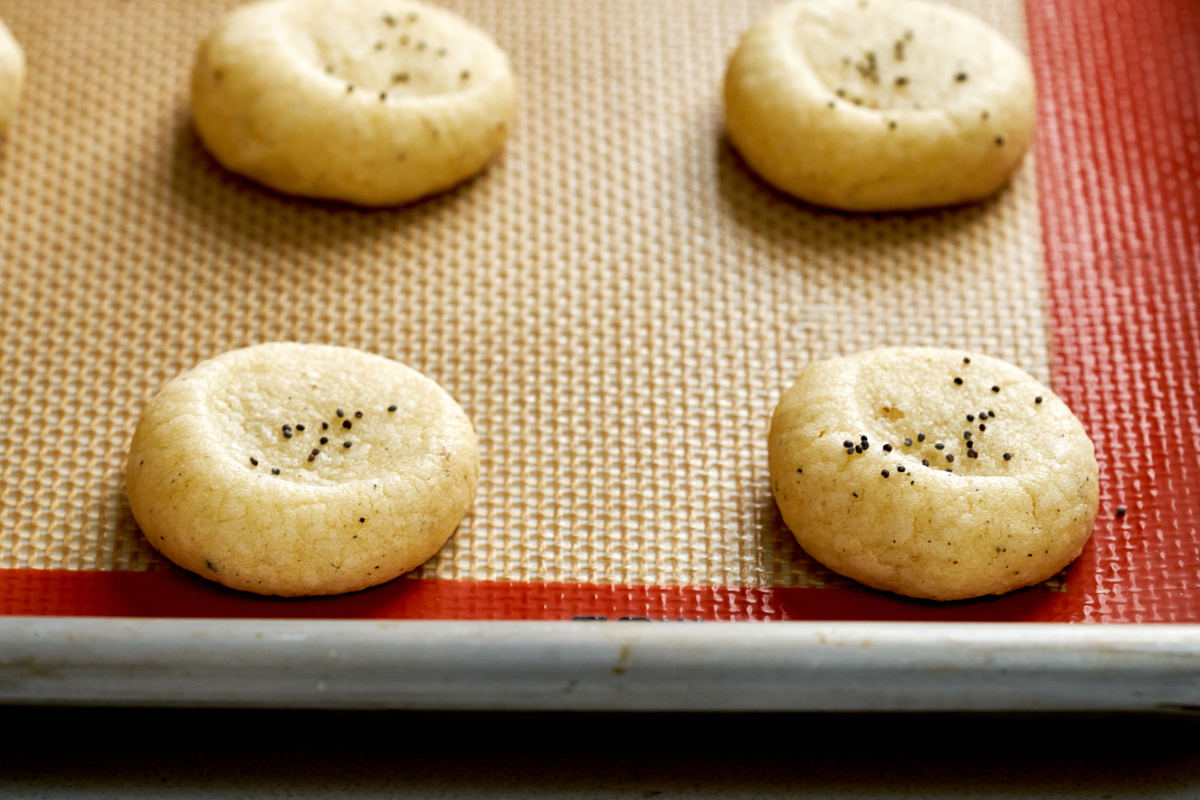 Cookies on a silicone baking sheet.