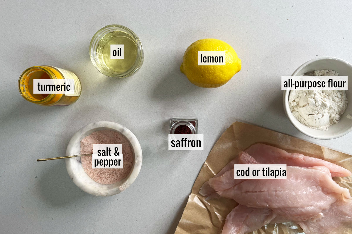 Ingredients to make saffron fish like lemon, cod, saffron, and turmeric.