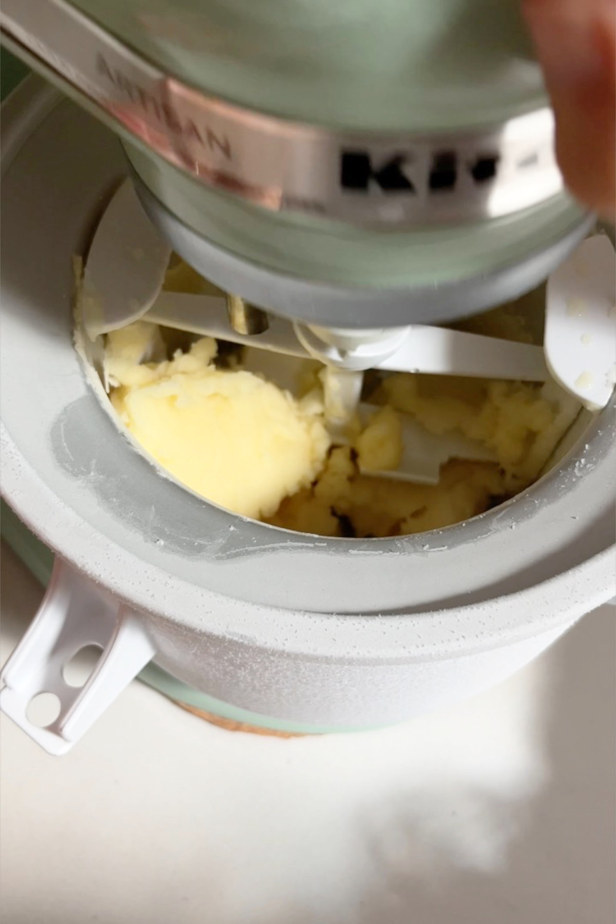 Churning yellow Dole Whip in an ice cream maker attachment.