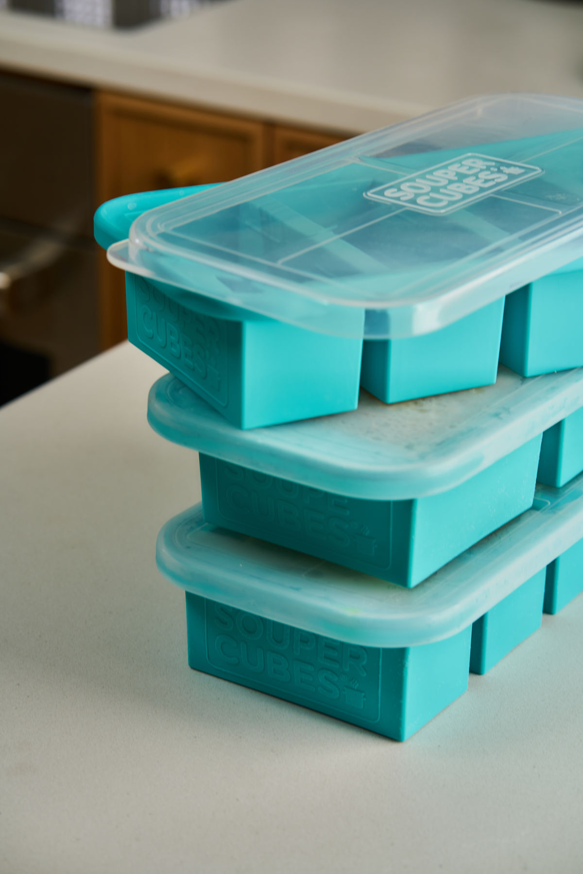 Turquoise silicone freezer trays with lids from Souper Cubes.