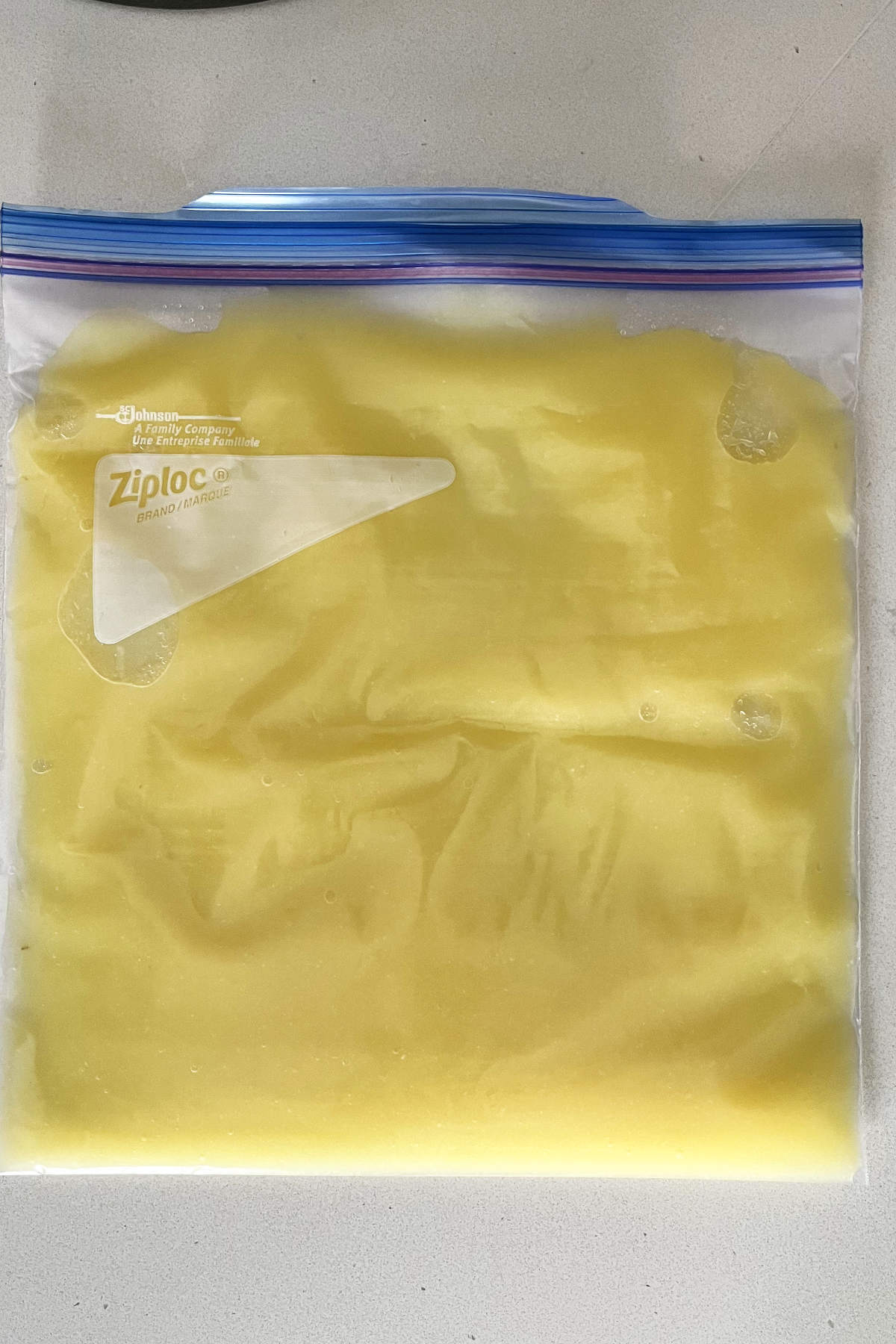 Yellow Dole Whip in a flat Ziploc bag.