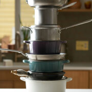 Stack of pots and pans on a kitchen countertop.