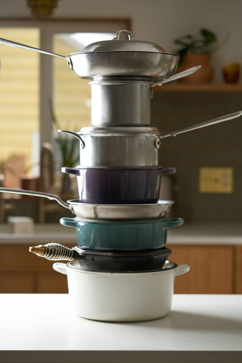 Stack of pots and pans on a kitchen countertop.