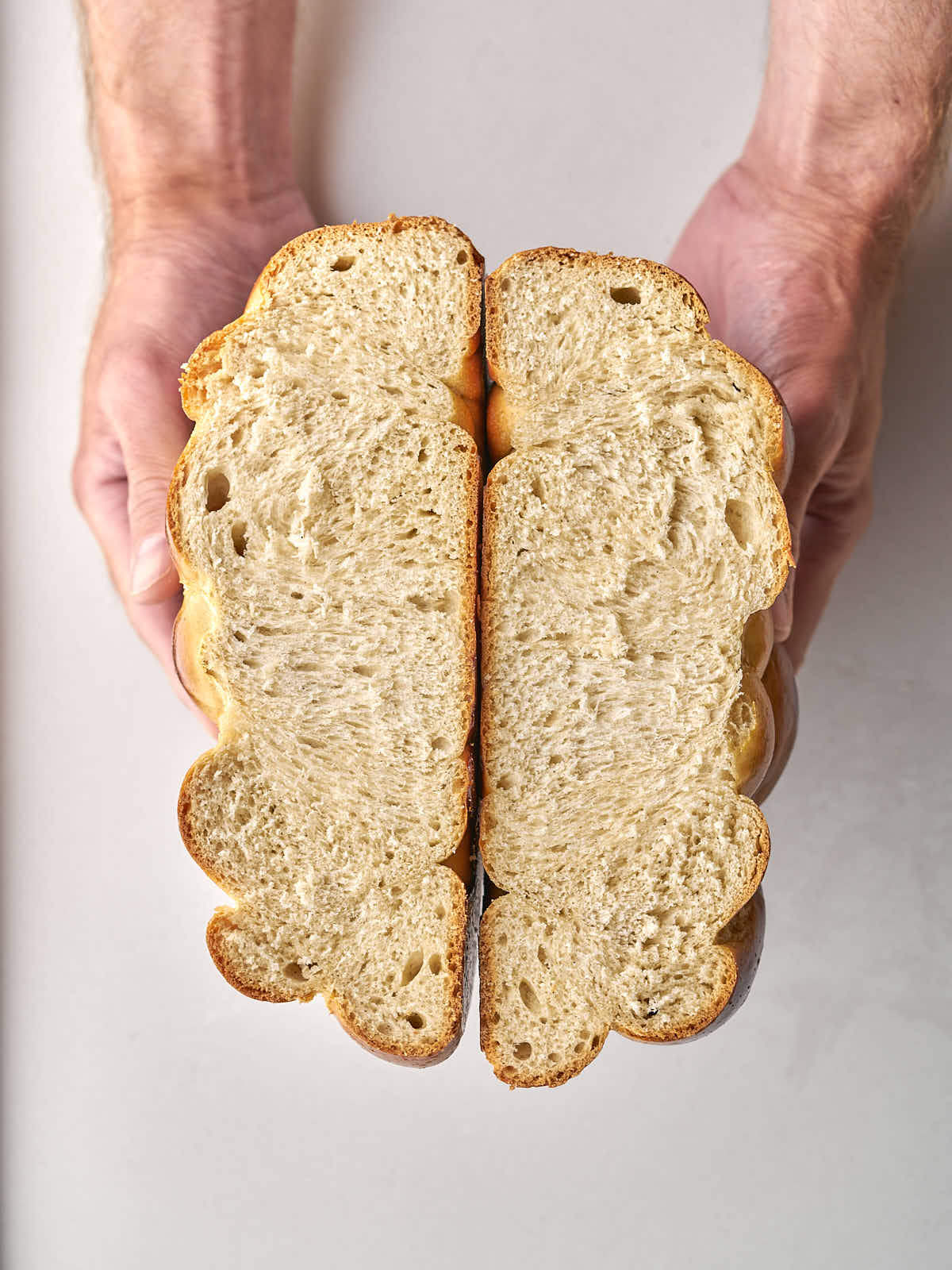 Loaf of sesame bread with slice cut out.