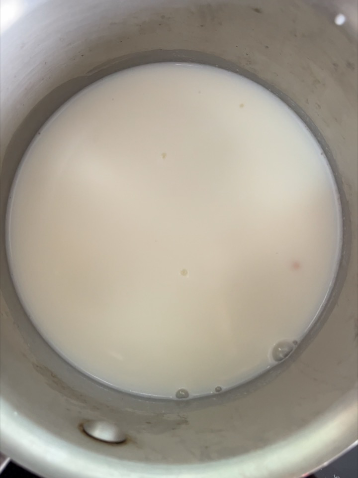 Milk in a metal pot.