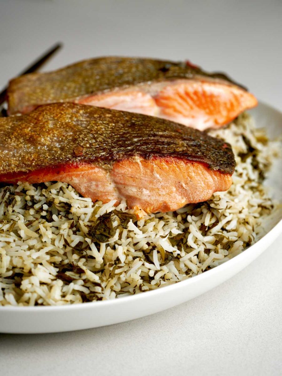 Herbed rice topped with crispy skin salmon.