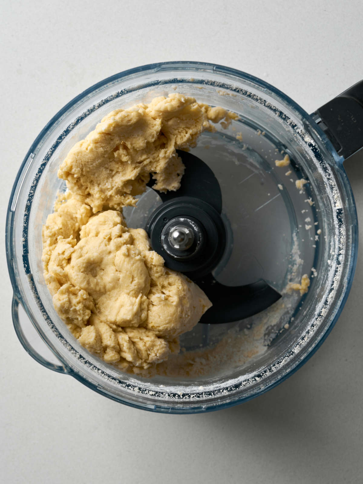 Dough in a food processor bowl.