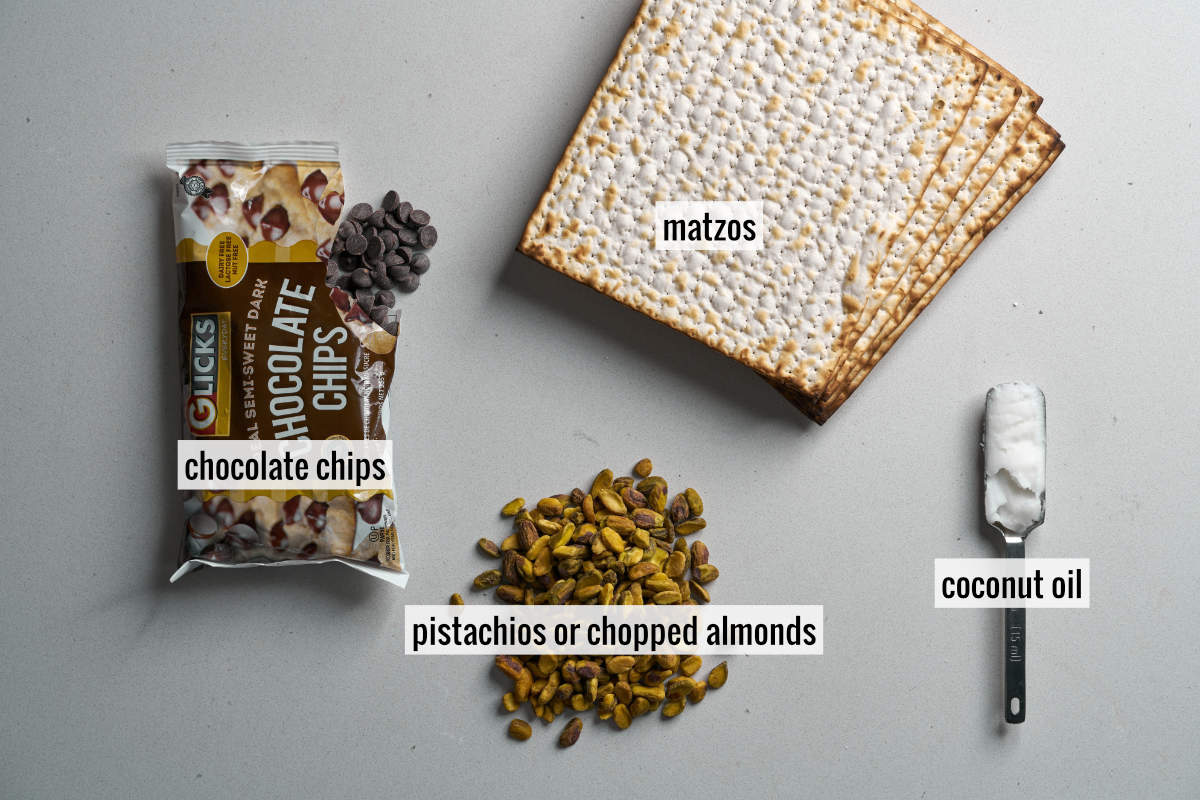 A photo four ingredients including matzo, chocolate chips, pistachios, and coconut oil.