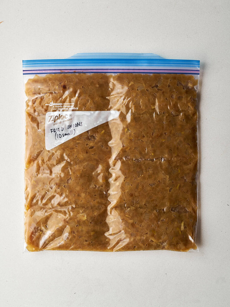 Caramelized onions pressed down in a large ziplock bag.