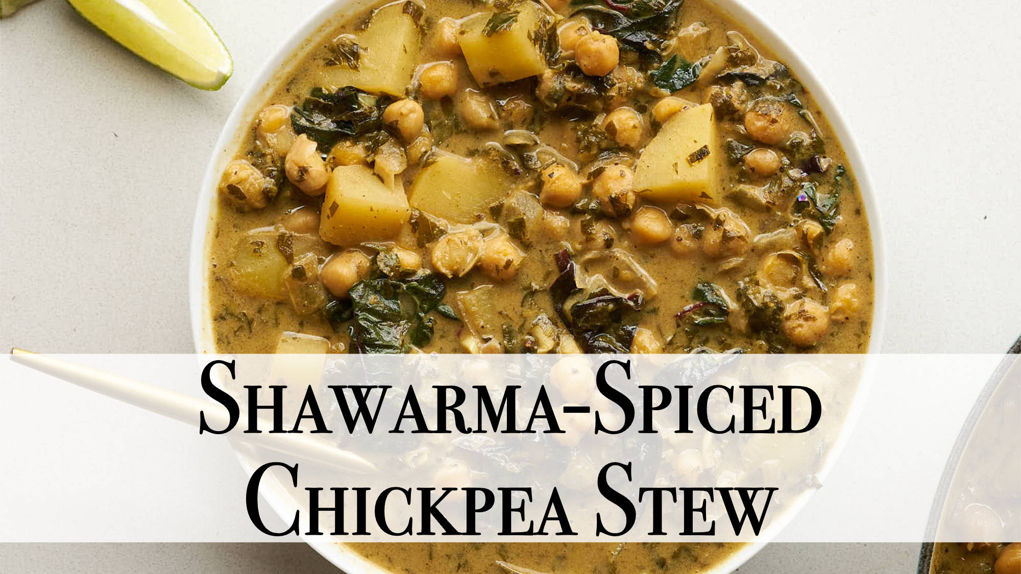 A bowl of chickpea stew featuring chickpeas, wilted greens, and diced potatoes in a rich golden sauce. Text on the image reads: "Shawarma-Spiced Chickpea Stew"